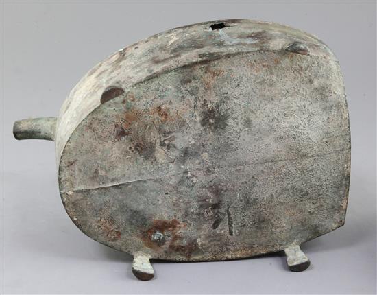 A Chinese archaic bronze steamer vessel, in two parts, Xian, Han dynasty, 206 B.C.-220 A.D., 30cm long, holes